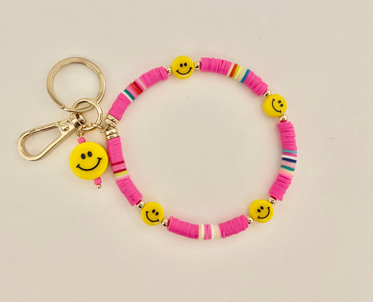 Pink smiley face wristlet