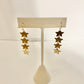 Dangly gold star earrings