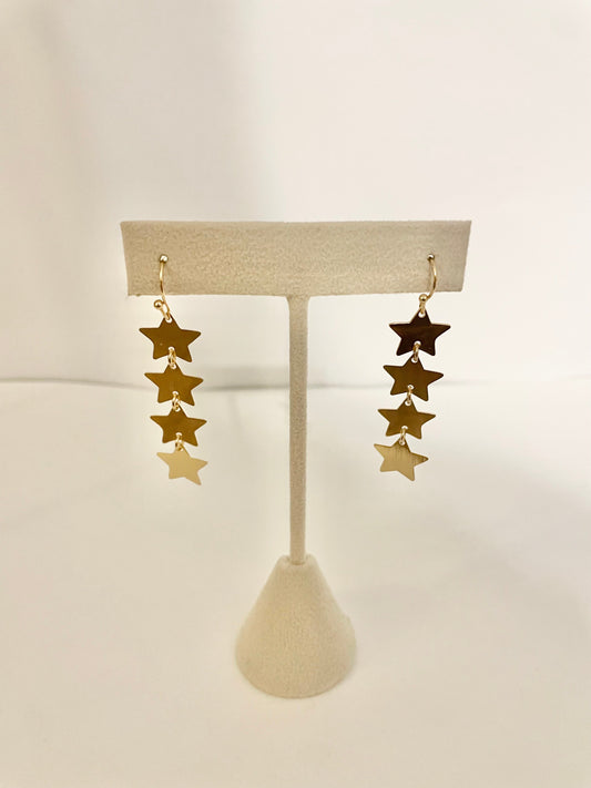 Dangly gold star earrings